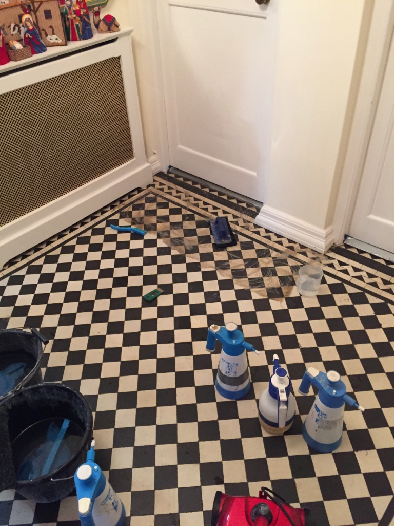 Renovating And Fixing Loose Tiles In A Victorian Hallway In Mill
