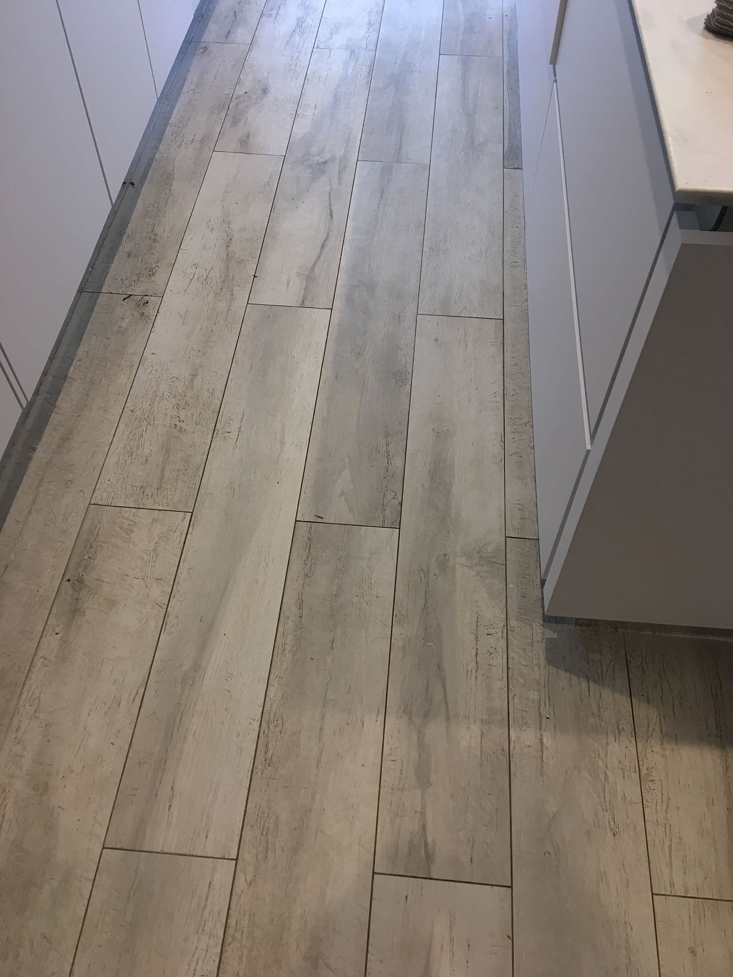 Grout Haze Removed from Newly Installed Wood Effect Porcelain Tiled